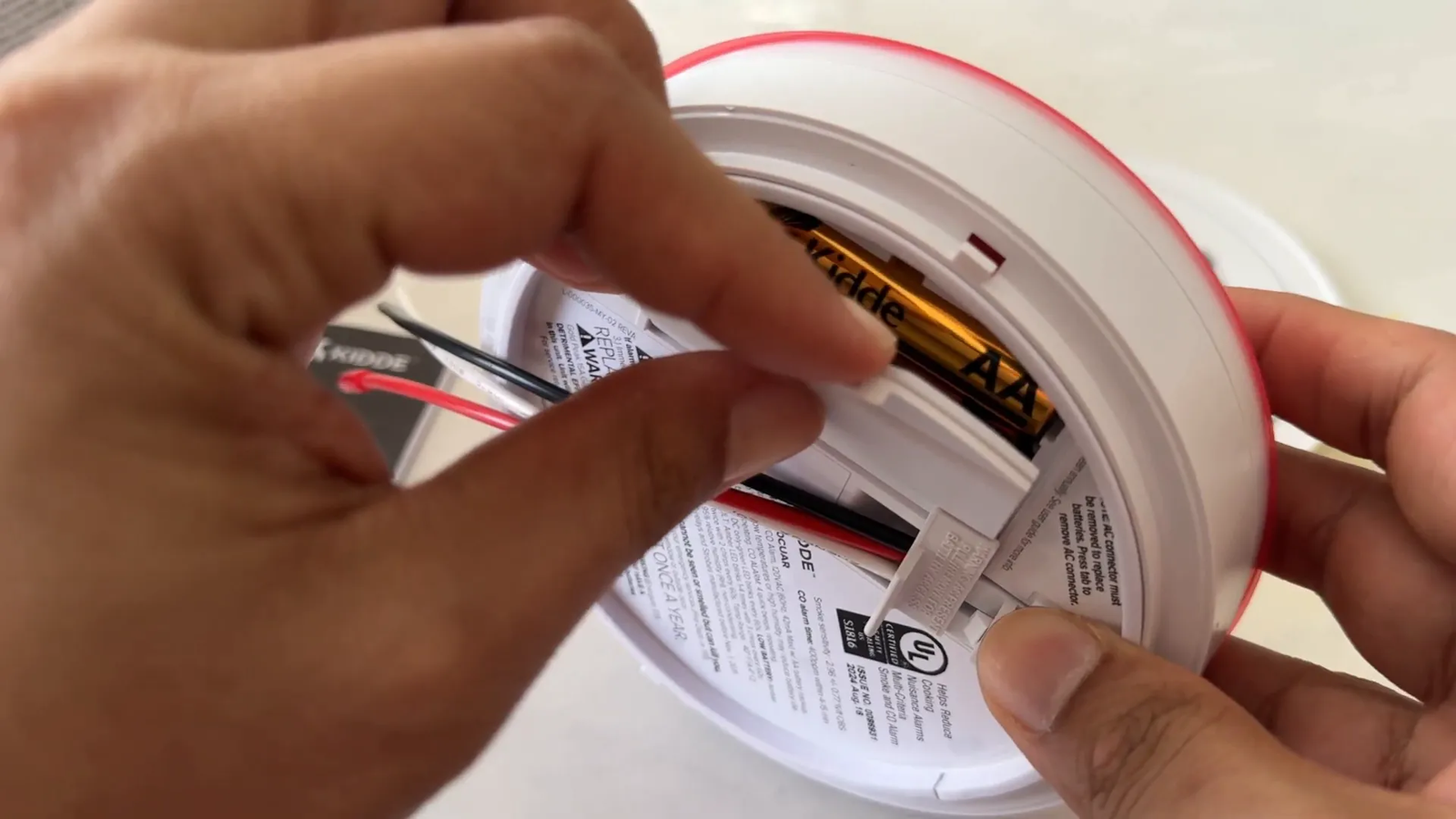 Activating backup batteries inside new alarm