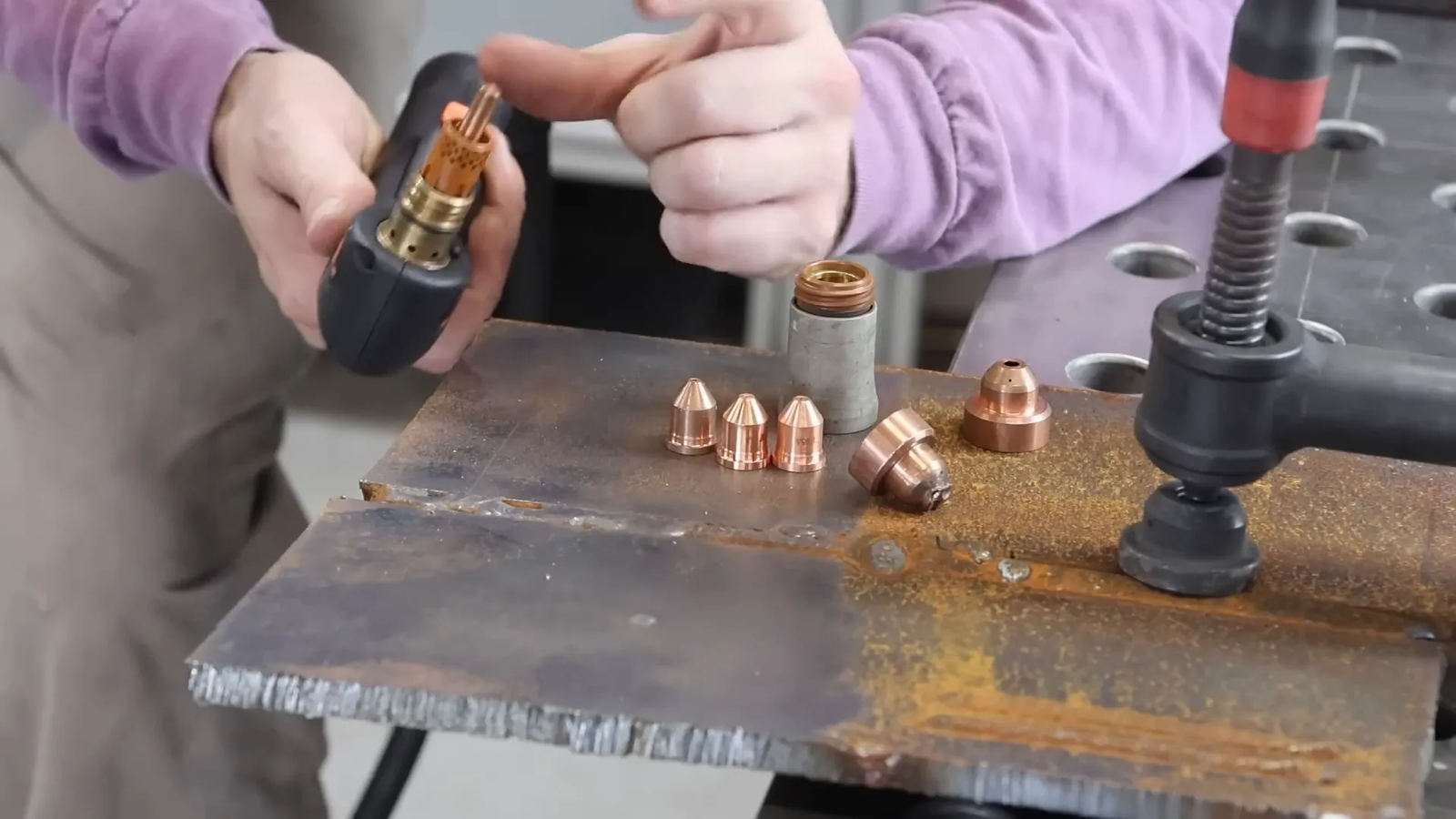 Swapping electrode and nozzle for plasma cutting thicker metal