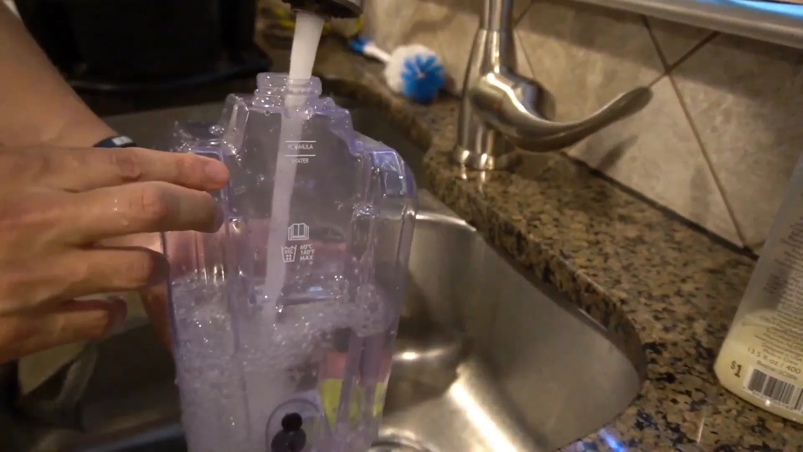 Filling solution container with water up to marked line