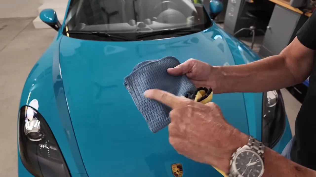 Waffle weave microfiber towel, squeegee, and microfiber wand laid out