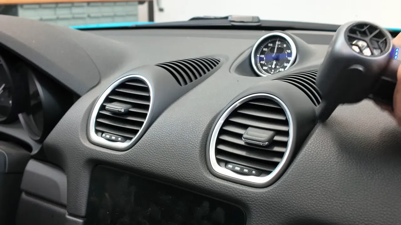 Using MF100 to blow dust from dashboard vents
