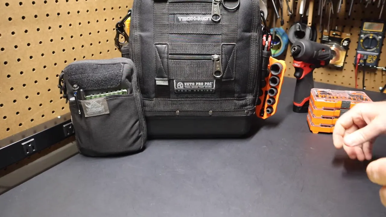 Carabiner clipped through the sleeve and attached to a Tech MCT D-ring