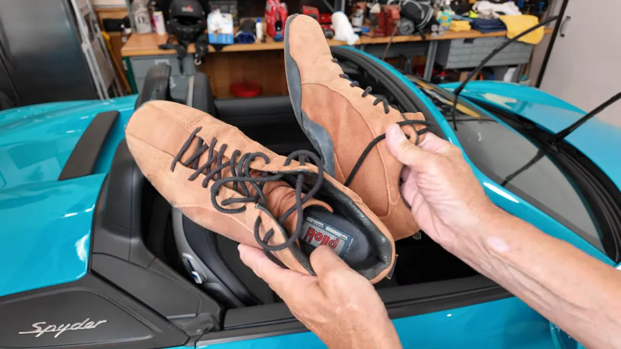 Closed-toe thin-soled driving shoes next to gloves