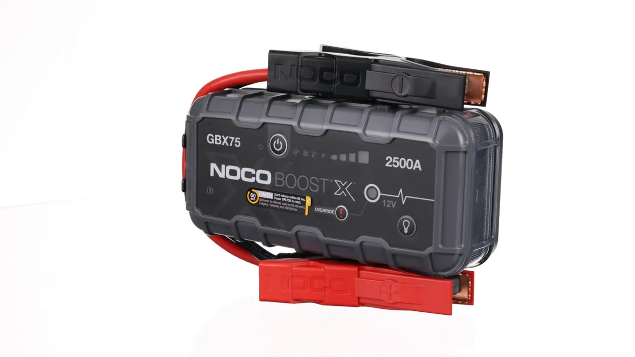 Jump starter tucked into a glove box ready for emergency use