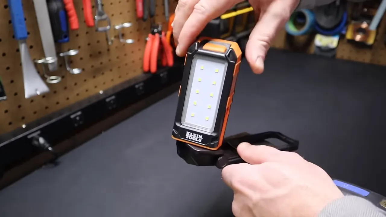 Klein Tools worklight standing and pivoted to shine forward