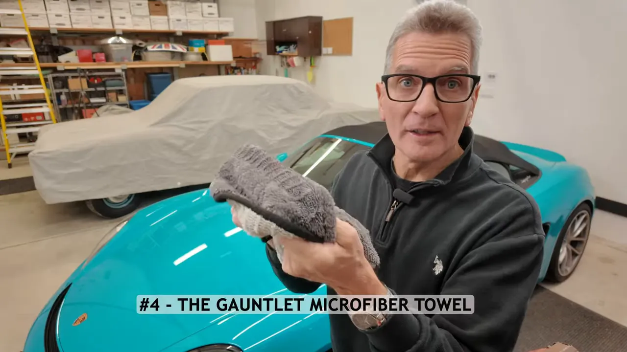 The Rag Company Gauntlet towel drying a large car panel