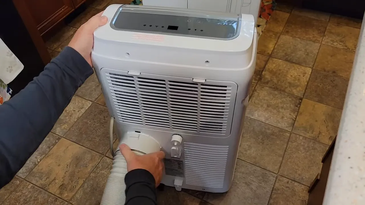 Snapping the hose adapter into the unit's exhaust
