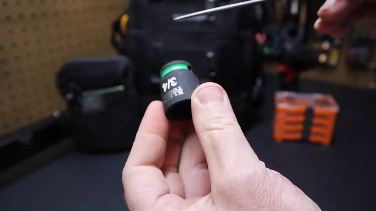 Pushing a socket out of the sleeve to show the groove retention