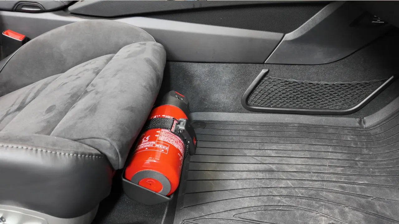 Mounted fire extinguisher in a car