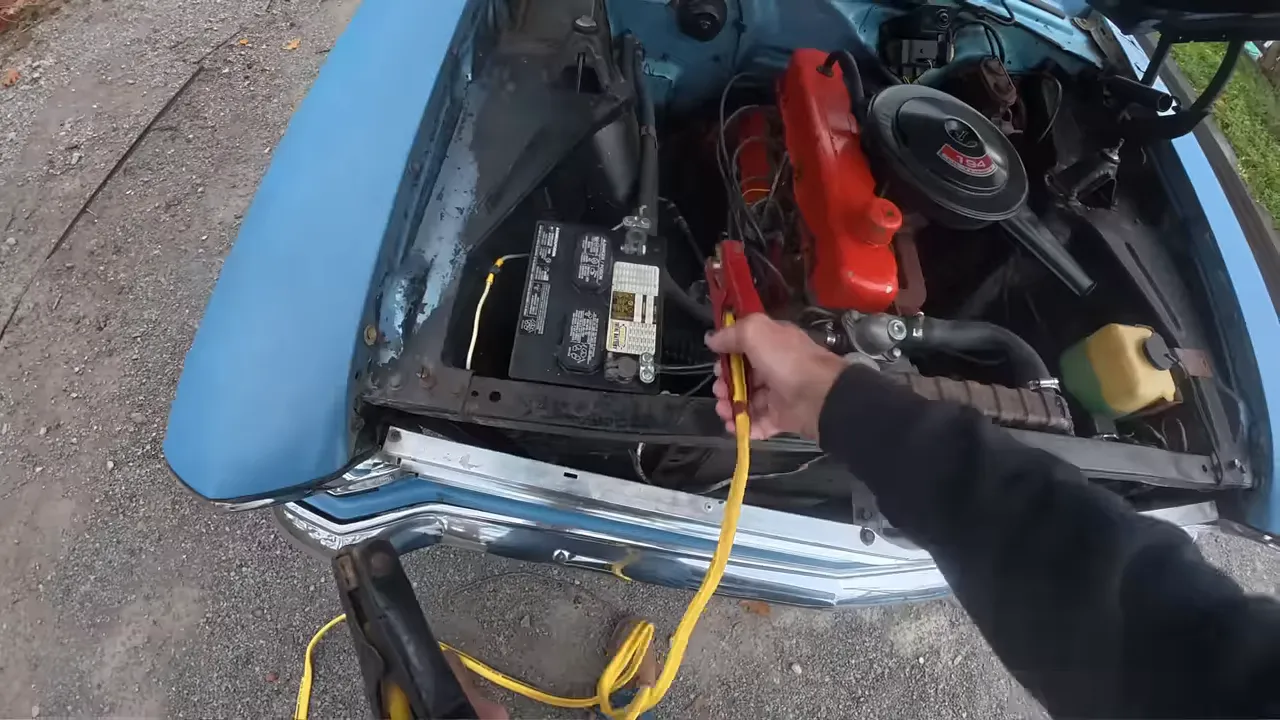 Two cars parked nose to nose ready for jumper cables
