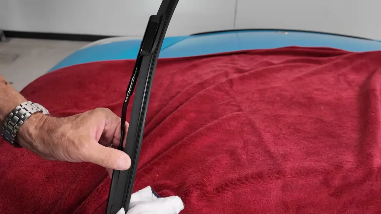 Dirty residue removed from wiper blade, showing buildup
