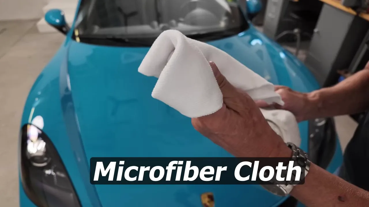 Old towel on hood, WD-40 can and a white sock ready