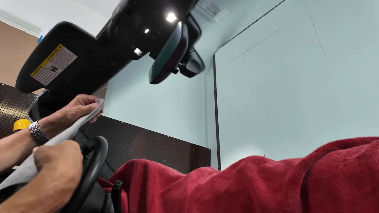 Folding waffle weave towel to reach the bottom edge of the windshield