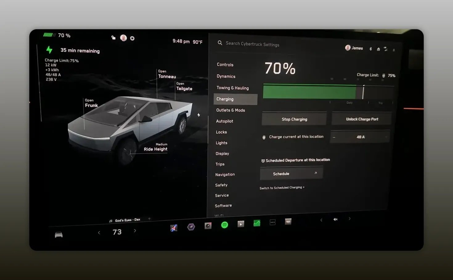 Tesla vehicle charging screen showing a 70 percent charge level and charging settings