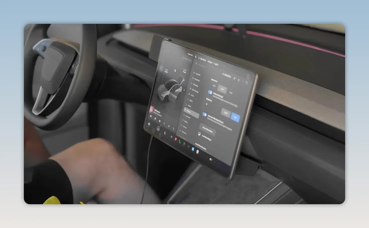 Tesla center touchscreen displaying vehicle settings with a matte screen protector installed